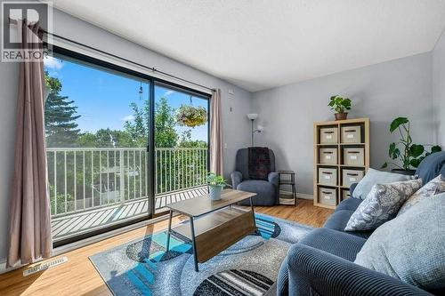 Bright Living room with Balcony and VIEWS! - 80, 1055 72 Avenue Nw, Calgary, AB - Indoor Photo Showing Living Room