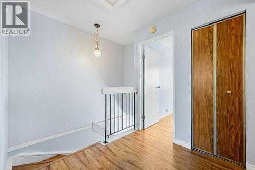 Upstairs landing with linnen closet - 80, 1055 72 Avenue Nw, Calgary, AB - Indoor Photo Showing Other Room