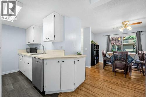 newer dishwasher - 80, 1055 72 Avenue Nw, Calgary, AB - Indoor Photo Showing Kitchen