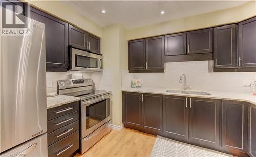 555 Chablis Drive Unit# 12, Waterloo, ON - Indoor Photo Showing Kitchen With Stainless Steel Kitchen With Double Sink