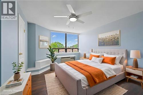Spacious room featuring wood-finish flooring, a contemporary ceiling fan with integrated lighting, and multiple large windows with horizontal blinds - 688 Preston Parkway Unit# 401, Cambridge, ON - Indoor Photo Showing Bedroom