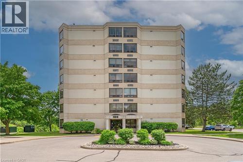 Multi-story building featuring a neutral-toned facade with horizontal banding - 688 Preston Parkway Unit# 401, Cambridge, ON - Outdoor