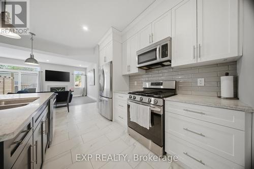 107 Stephenson Way, Minto, ON - Indoor Photo Showing Kitchen With Stainless Steel Kitchen With Double Sink With Upgraded Kitchen