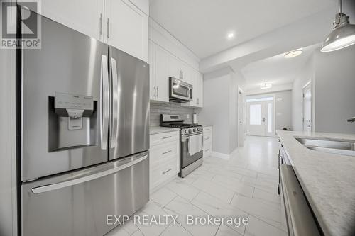 107 Stephenson Way, Minto, ON - Indoor Photo Showing Kitchen With Stainless Steel Kitchen With Upgraded Kitchen