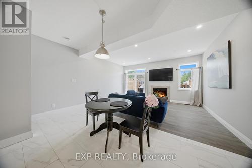 107 Stephenson Way, Minto, ON - Indoor Photo Showing Dining Room With Fireplace