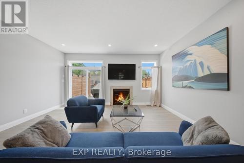 107 Stephenson Way, Minto, ON - Indoor Photo Showing Living Room With Fireplace
