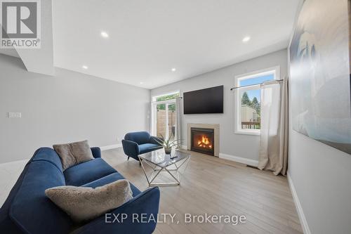 107 Stephenson Way, Minto, ON - Indoor Photo Showing Living Room With Fireplace