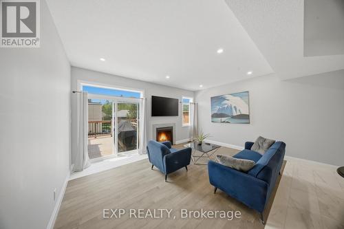 107 Stephenson Way, Minto, ON - Indoor Photo Showing Other Room With Fireplace
