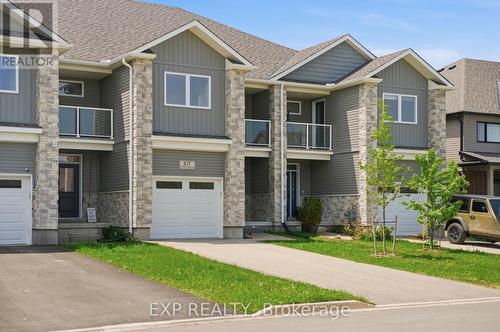 107 Stephenson Way, Minto, ON - Outdoor With Balcony With Facade