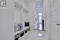 Mudroom with builtins and entrance to garage - 