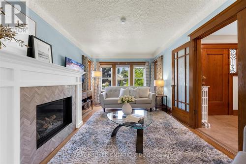 99 Tuxedo Avenue S, Hamilton, ON - Indoor Photo Showing Living Room With Fireplace
