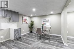 Interior space featuring wood-finish flooring, recessed lighting, and a neutral color palette - 