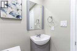 Bathroom vanity with an integrated sink and chrome faucet - 