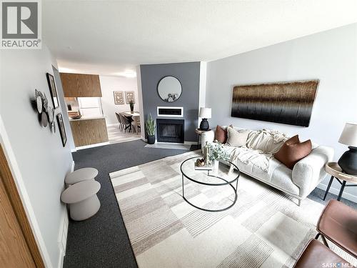 376 Cedar Meadow Drive, Regina, SK - Indoor Photo Showing Living Room With Fireplace