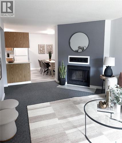376 Cedar Meadow Drive, Regina, SK - Indoor Photo Showing Living Room With Fireplace