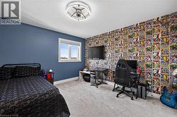 Light gray carpet flooring complementing a vibrant accent wall - 