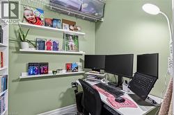 Dedicated workspace featuring soft green walls and white trim - 