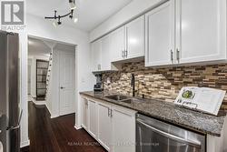 Granite Counters and Stylish Backsplash - 