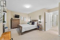 Spacious Primary Bedroom w Wallmount TV - 