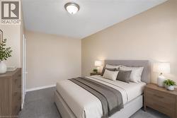 Carpeted room featuring neutral wall tones and a ceiling-mounted light fixture - 