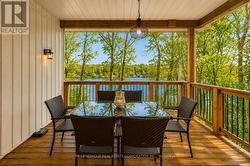Walkout to Covered Deck Overlooking the Lake - 