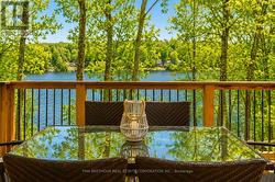 Covered Deck Overlooking the Lake - 