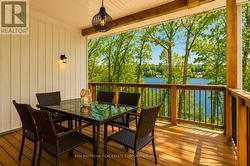 Covered Deck Overlooking the Lake - 