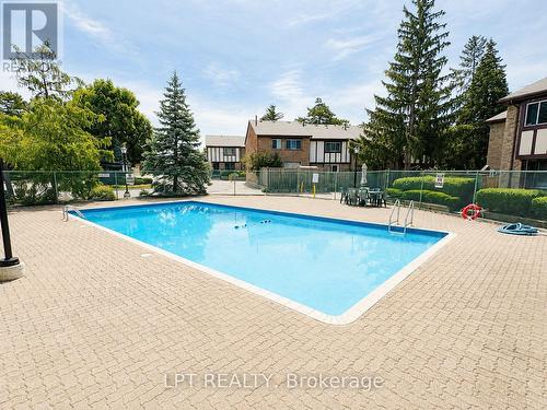 63 - 100 Burrows Hall Boulevard, Toronto, ON - Outdoor With In Ground Pool With Backyard