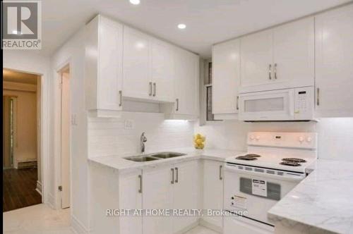 Bsmt - 34 Macpherson Avenue, Toronto, ON - Indoor Photo Showing Kitchen With Double Sink