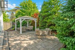 Low Maintenence rear yard w gazebo & mature trees - 