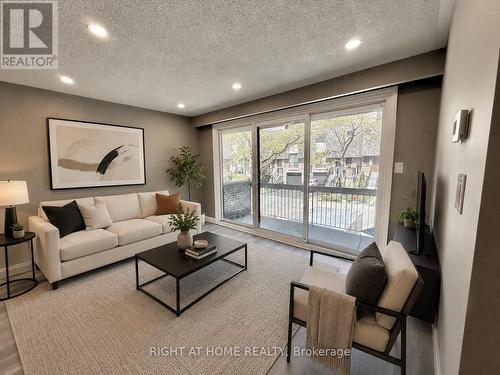 Virtually Staged - 24 - 7 Vale Carse Way, Toronto, ON - Indoor Photo Showing Living Room
