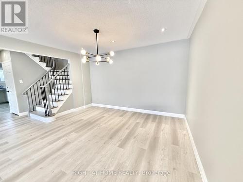 New Light Fixtures - Renovated Staircase. - 24 - 7 Vale Carse Way, Toronto, ON - Indoor Photo Showing Other Room