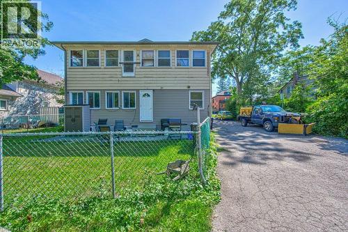Two-story exterior with light-toned siding and multiple windows - 819 Duke Street, Cambridge, ON - Outdoor