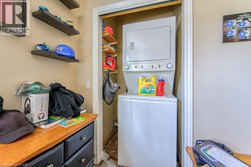 Stackable laundry appliances within a dedicated closet - 819 Duke Street, Cambridge, ON - Indoor