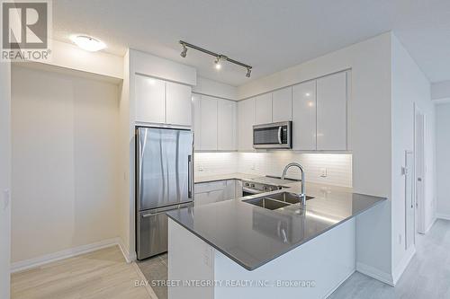 710 - 3260 Sheppard Avenue E, Toronto, ON - Indoor Photo Showing Kitchen With Double Sink With Upgraded Kitchen