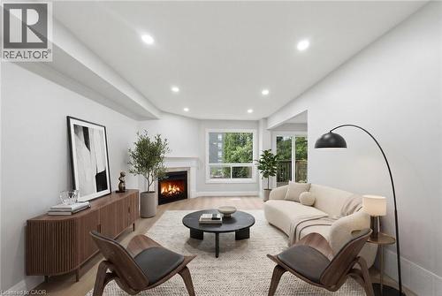 Virtual Staged - 2155 Duncaster Drive Unit# 2, Burlington, ON - Indoor Photo Showing Living Room With Fireplace