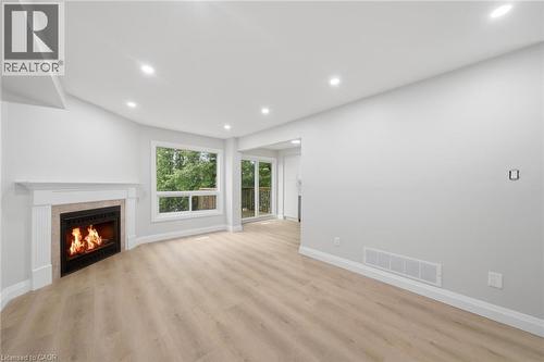 2155 Duncaster Drive Unit# 2, Burlington, ON - Indoor With Fireplace