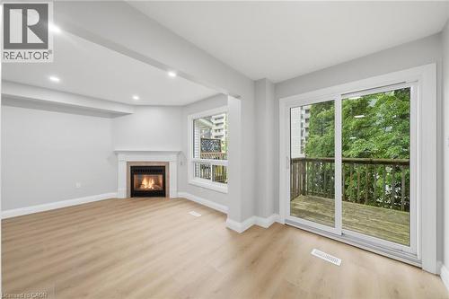 2155 Duncaster Drive Unit# 2, Burlington, ON - Indoor Photo Showing Living Room With Fireplace