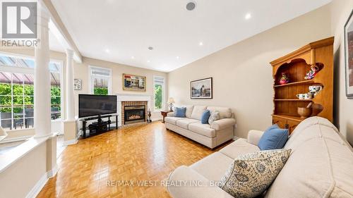 Family Room with Gas Fireplace & Large Windows - 71 Gidleigh Park Crescent, Vaughan, ON - Indoor Photo Showing Living Room With Fireplace