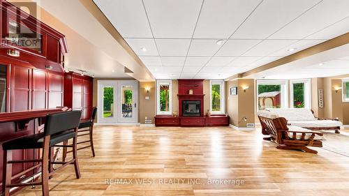 Walkout Lower Level Opening to Private Backyard - 71 Gidleigh Park Crescent, Vaughan, ON - Indoor With Fireplace