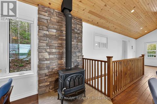 Jotul F 400 Fireplace - 442 Silver Birch Drive, Tiny, ON - Indoor Photo Showing Other Room
