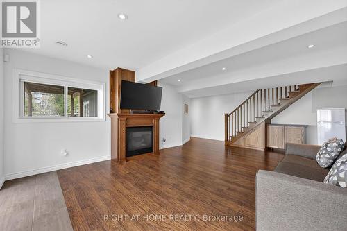 442 Silver Birch Drive, Tiny, ON - Indoor Photo Showing Living Room With Fireplace