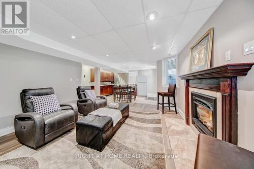 Lower-Family Room - 126 Moore Crescent, Hamilton, ON - Indoor Photo Showing Living Room With Fireplace