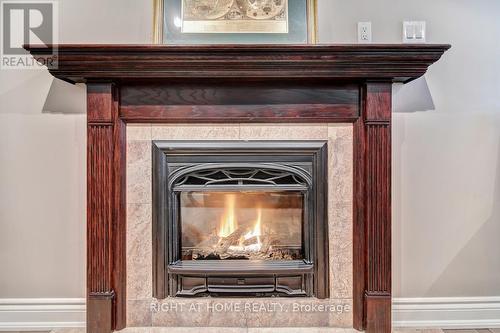 Lower-Family Room Cast Iron-Fireplace Insert - 126 Moore Crescent, Hamilton, ON - Indoor Photo Showing Living Room With Fireplace