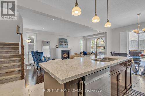 321 Carriage Way, Waterloo, ON - Indoor Photo Showing Kitchen With Fireplace With Double Sink
