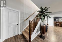 OAK STAIRCASE DECENDING TO LOWER FLOOR - 