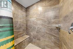LOWER LEVEL SHOWER WITH SEAT - 