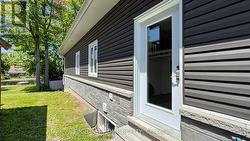 SIDE DOOR ENTRANCE TO LAUNDRY ROOM - 