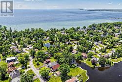 TUCKED BEHIND LAKE SIMCOE'S WESTERN SHORES - 