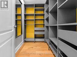 Primary Walk in Closet With Built In-s - 